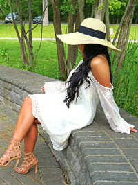 Tan Wide Brimmed Floppy Hat With Black Ribbon Hat Band